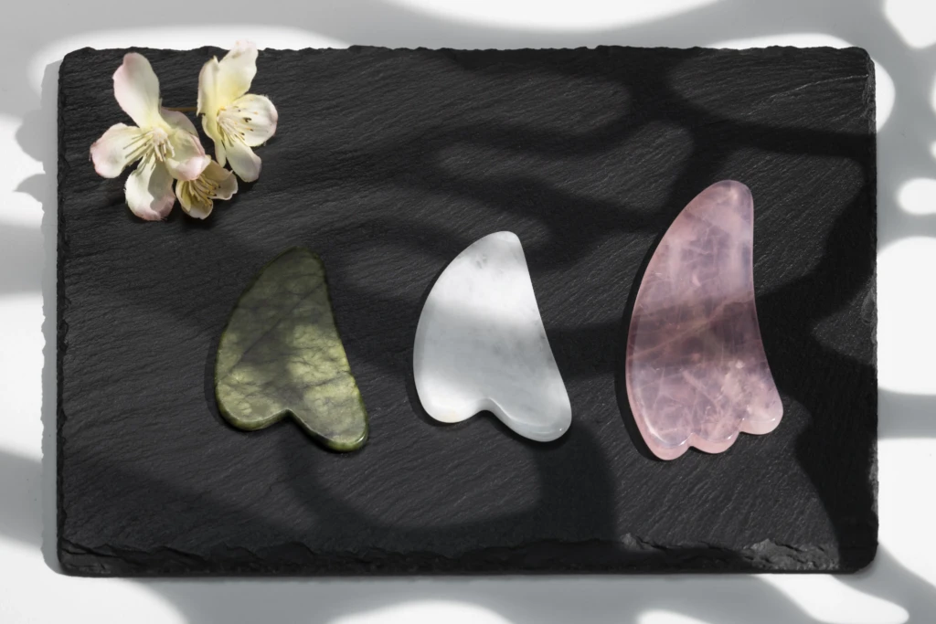 top view gua sha tools flowers